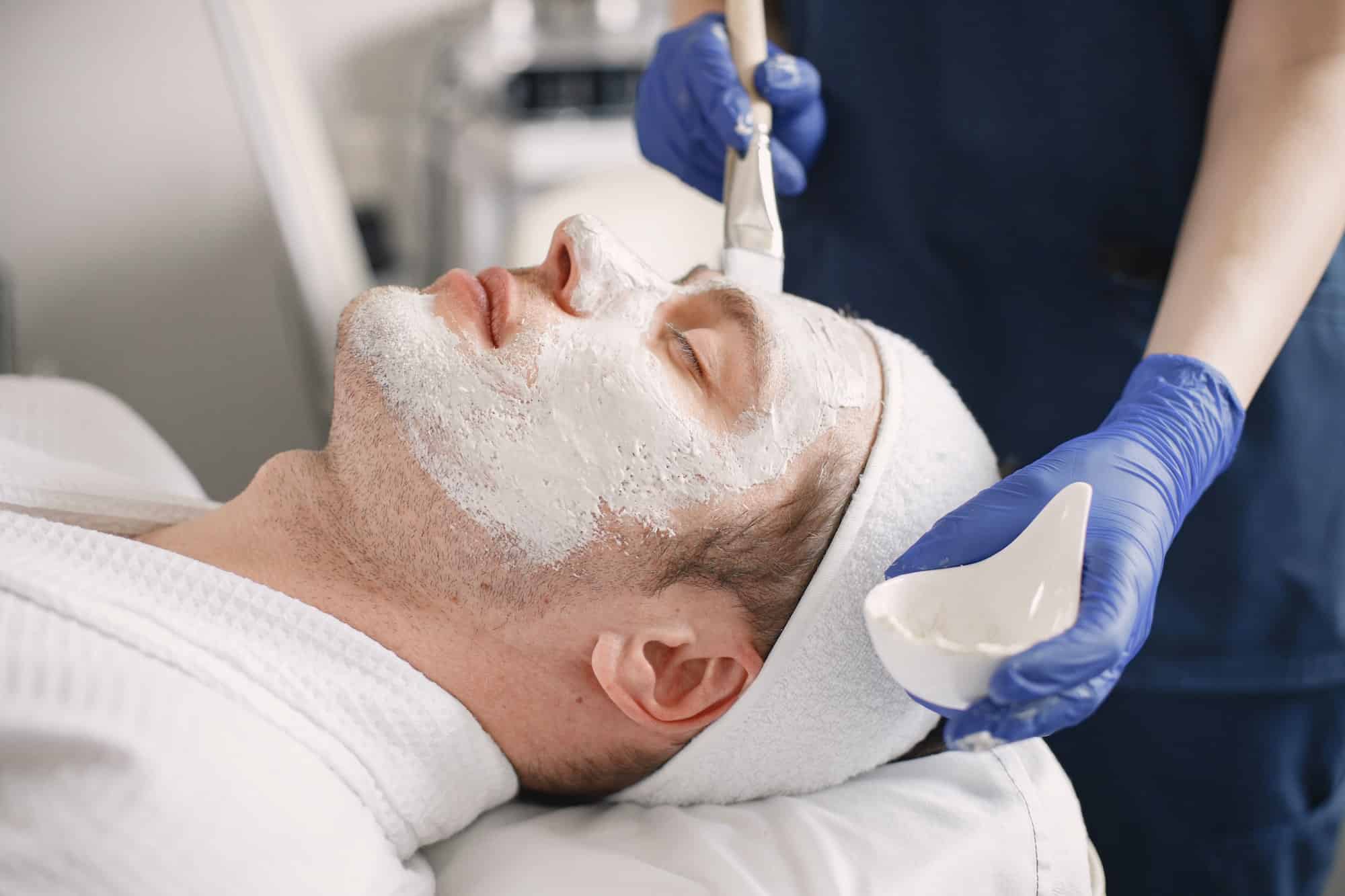 Close-up on a man in cosmetologist cabinet has a skincare procedure