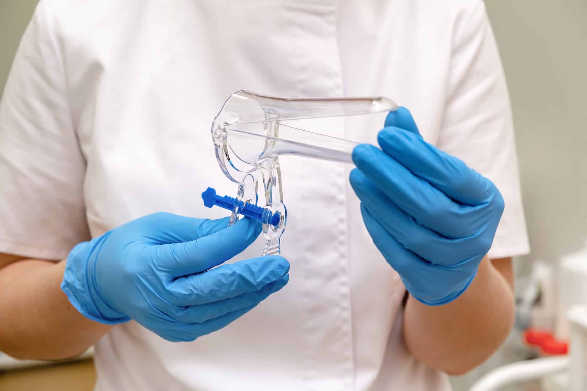 Gynecologist holding vaginal speculum in his hands closeup.Women's health.