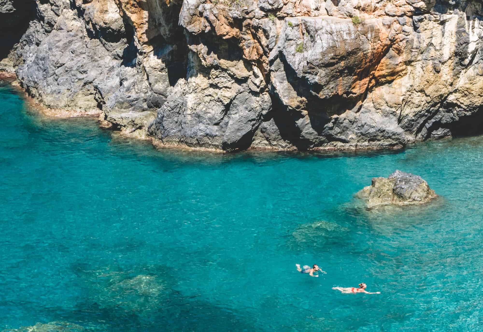 swimming in the blue sea of calabria italy